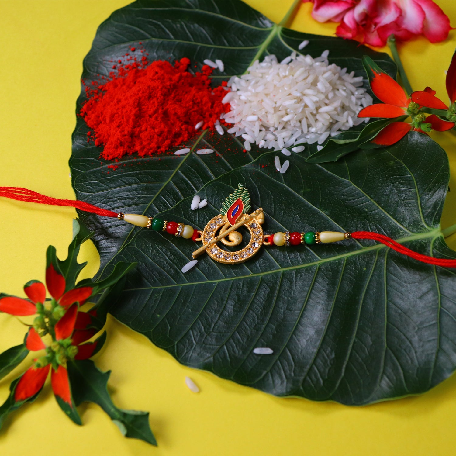 Krishna Flute Rakhi With Stone Studded Peacock Feather Design Krishna Flute Rakhi With Stone Studded Peacock Feather Design
